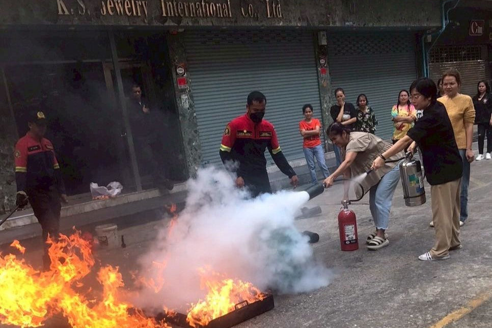 Fire extinguishing demonstration in front of K.S. Jewelry International Co., Ltd.